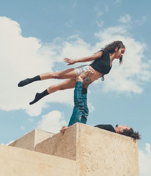 Man performing a controlled strength exercise in a minimalist setting.